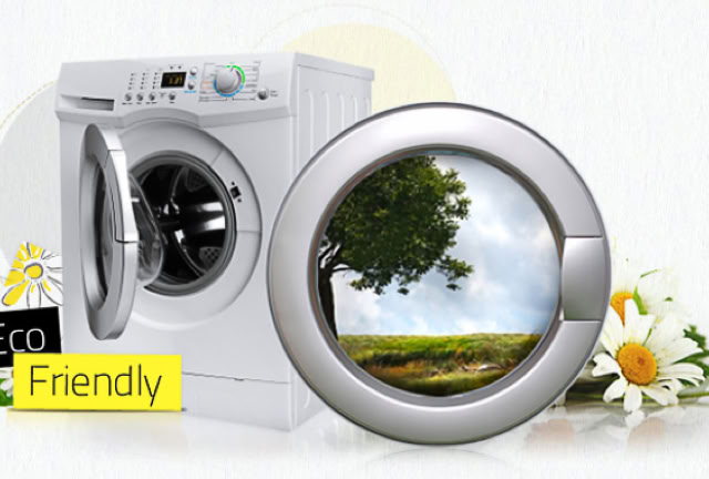 A washing machine with an open door, a circular frame showing a tree and sky, daisies, and a small sign reading "Eco Friendly."